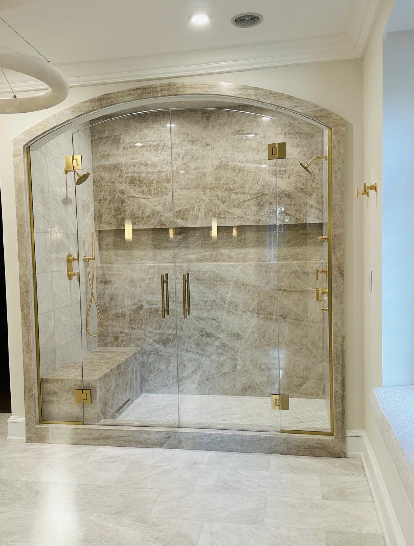Custom Arched Enclosure — Frameless glass • Satin brass hardware